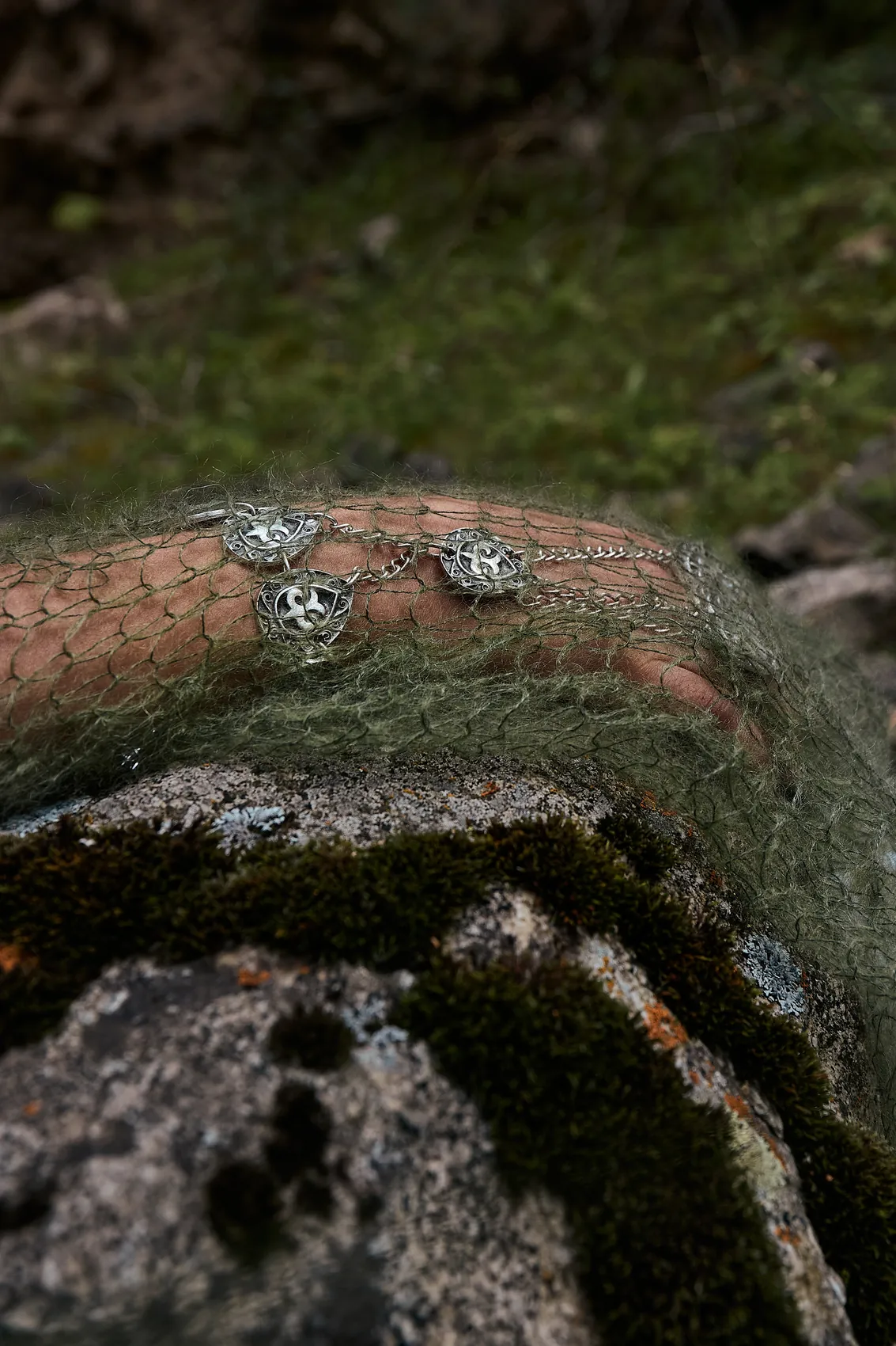 Mohair net resting on moss-covered rock