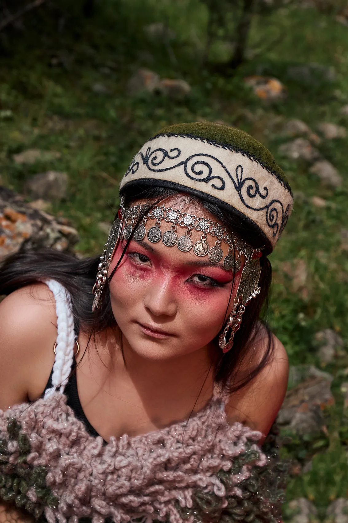 Close portrait with red make-up and headpiece