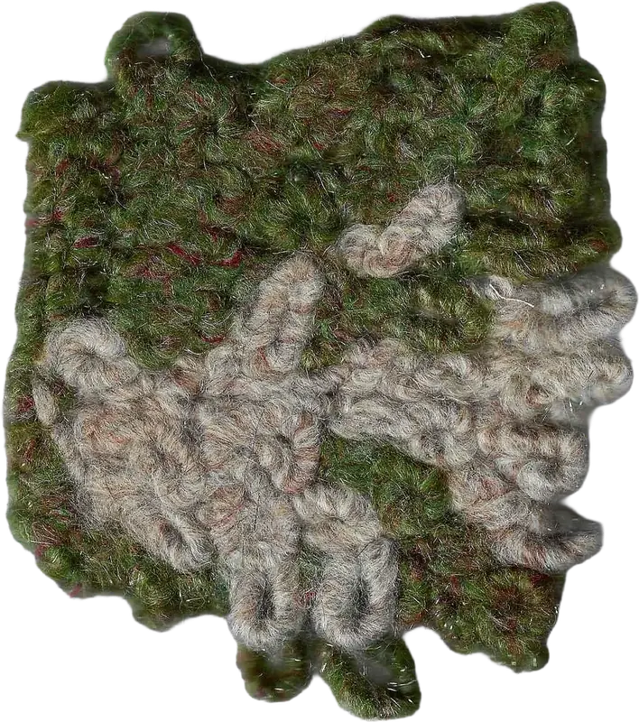 Knitted swatch in moss green with pale grey yarn islands