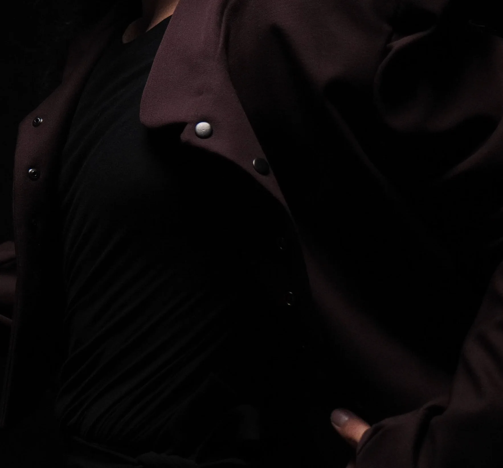 The jacket in the dark, collar and buttons