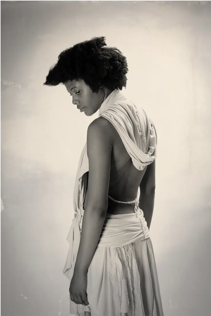 Back view of a draped open-back top