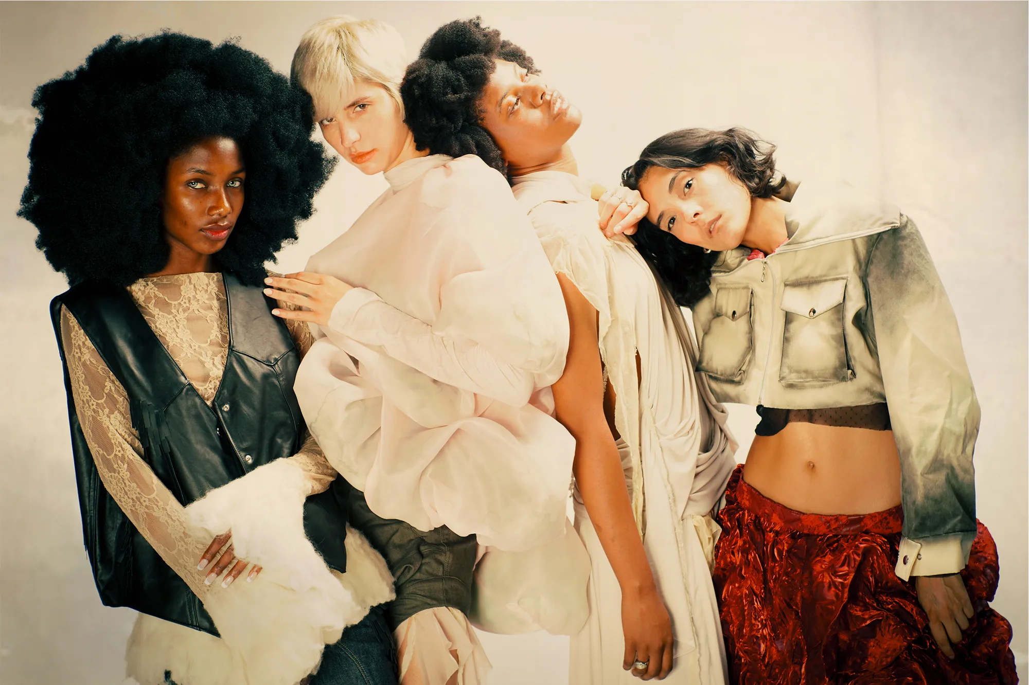 Four models wearing looks from The Smell of Belonging collection
