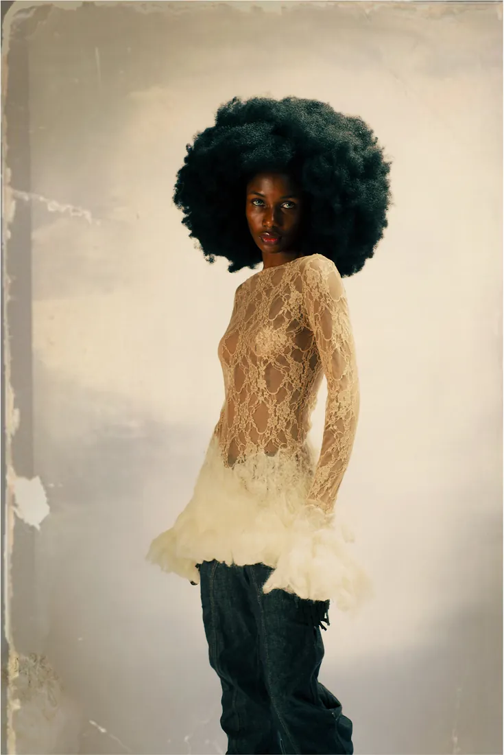 Sheer lace top with ruffled hem