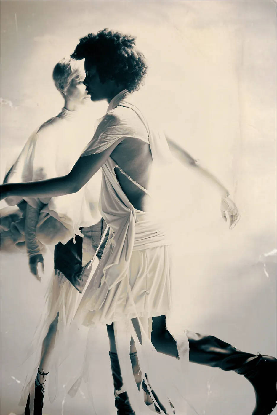 Model in motion wearing a backless dress, blurred