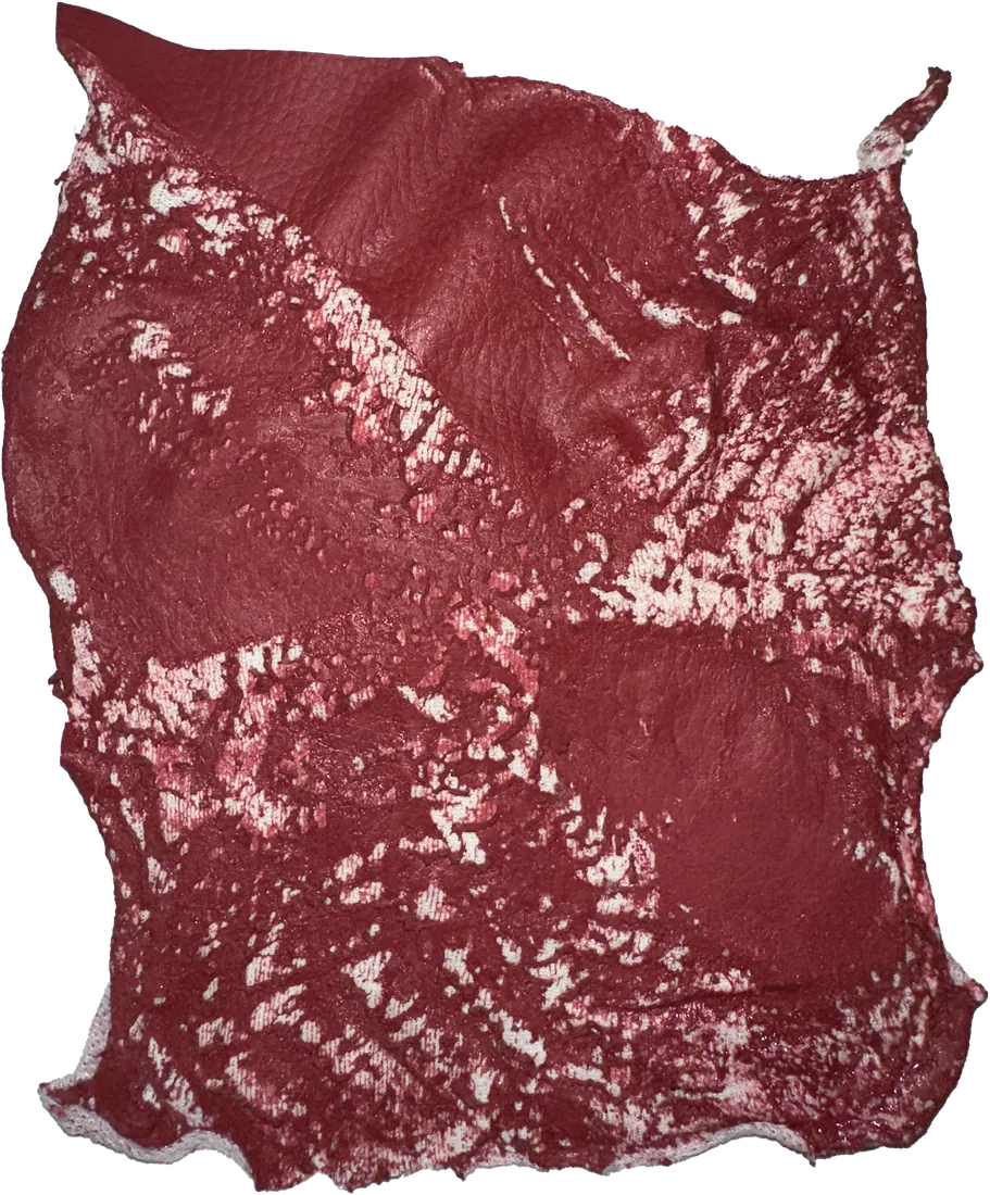 Red material with bleached marks