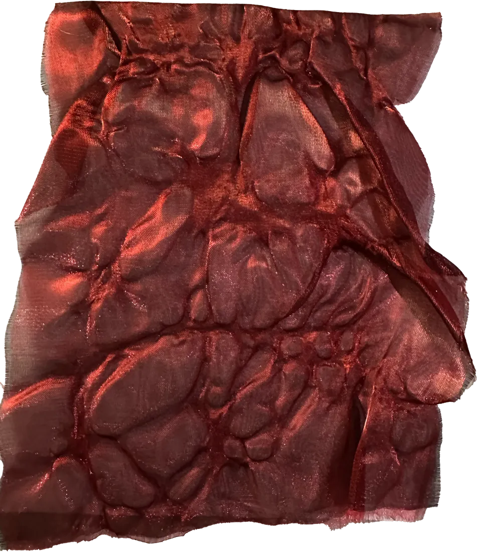 Glossy red melted material